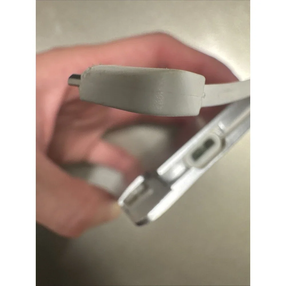 Ultra Slim portable charger silver with looks like Micro-USB cord see photos